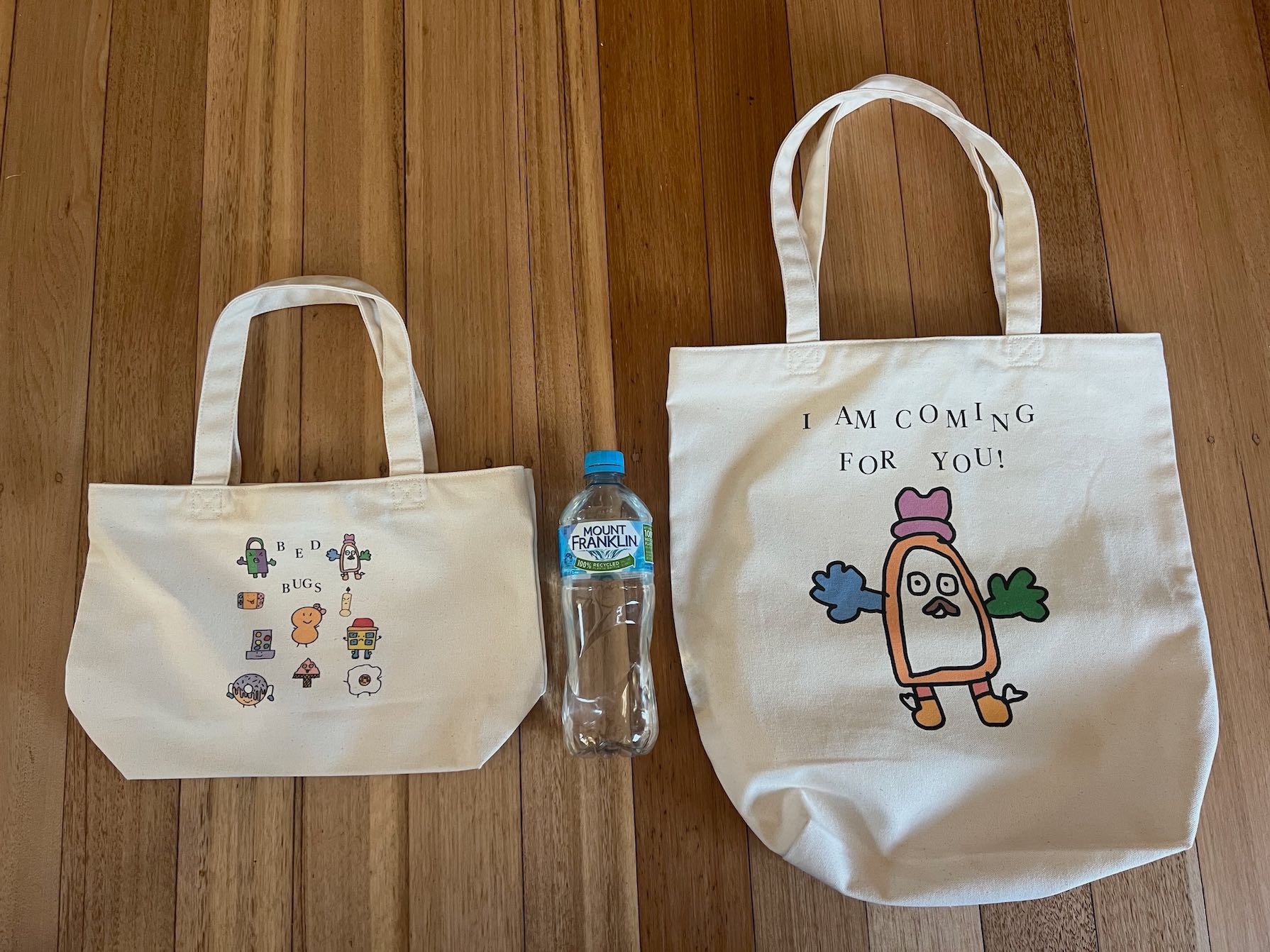 Size comparison of large and mini tote bags